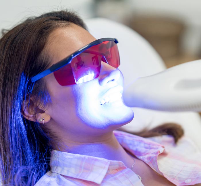 Woman having teeth whitened